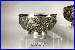 A Fine Antique Pair of Signed Chinese Silver Dragon Bowls