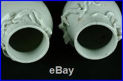 A Pair of Early Antique Chinese Blanc de Chine Dragon Vases