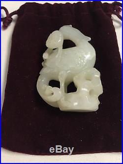 A chinese 19th 20th century carved white jade Phoenix on a rock