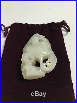 A chinese 19th 20th century carved white jade Phoenix on a rock
