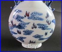 Antique Chinese blue and white porcelain dragon on both sides. The vase