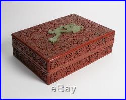 Antique Chinese cinnabar lacquer box with inset dragon