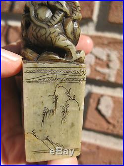 Antique soap stone dragon statue with carvings and Chinese characters, signed