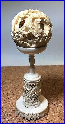 Vintage Chinese carved Dragon Puzzle ball with stand